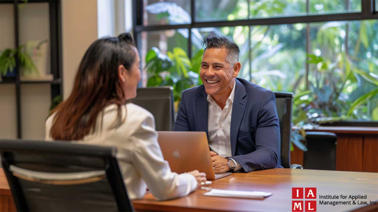 Engaged professionals conversing over Benefits Law Certifications in a sunny office environment.